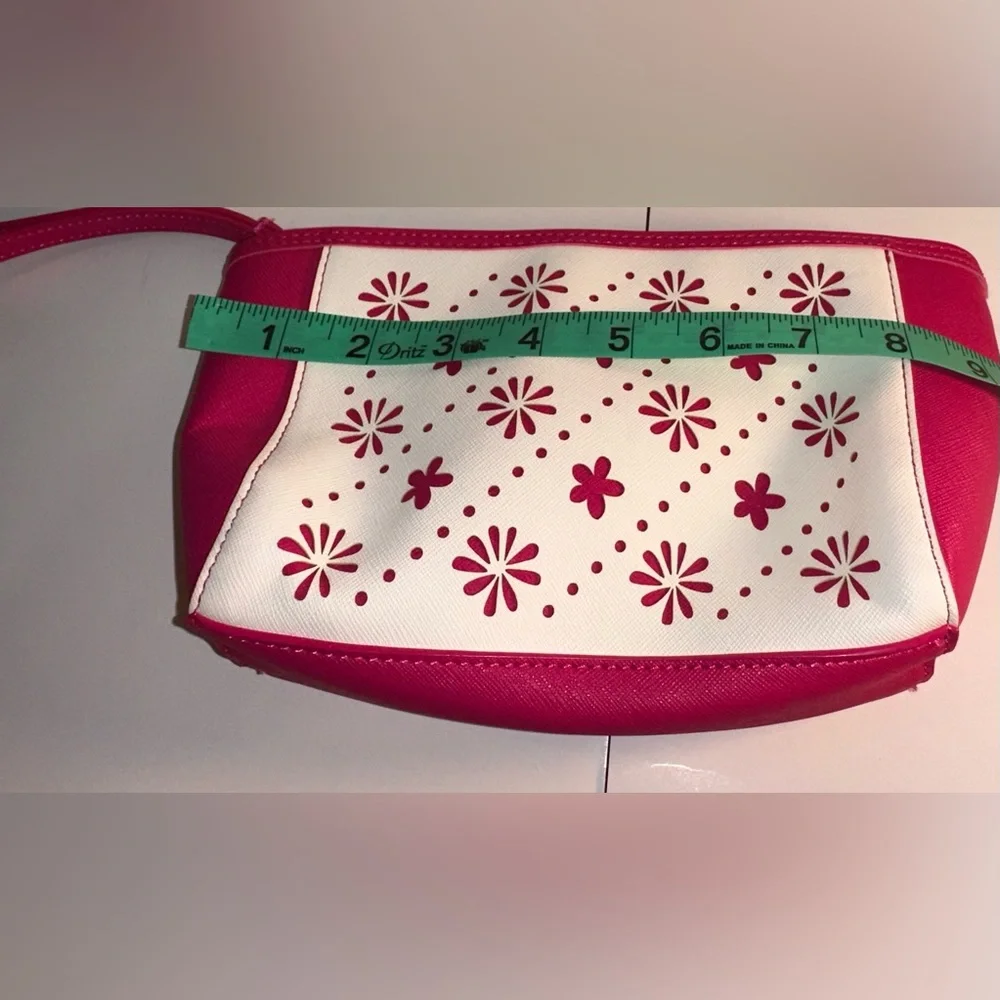 Vera Bradley Pink and White Laser Cut Floral Wristlet.